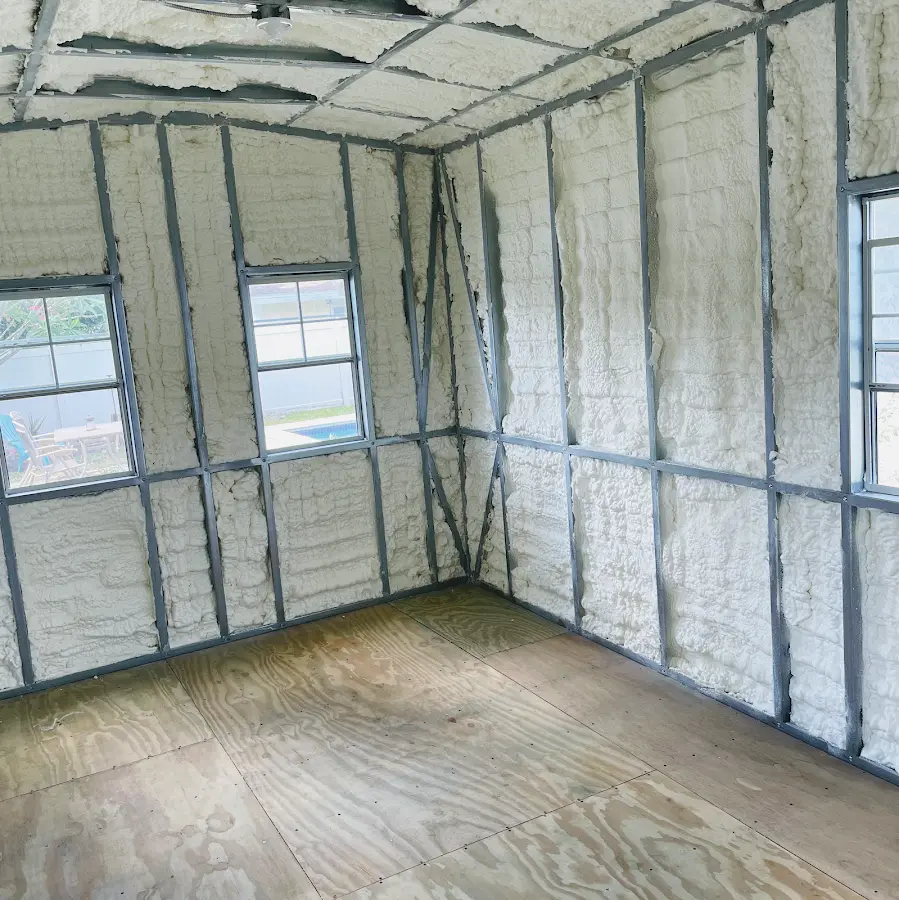 Closed-cell spray foam insulation applied to wall cavities in a residential project in South Kensington